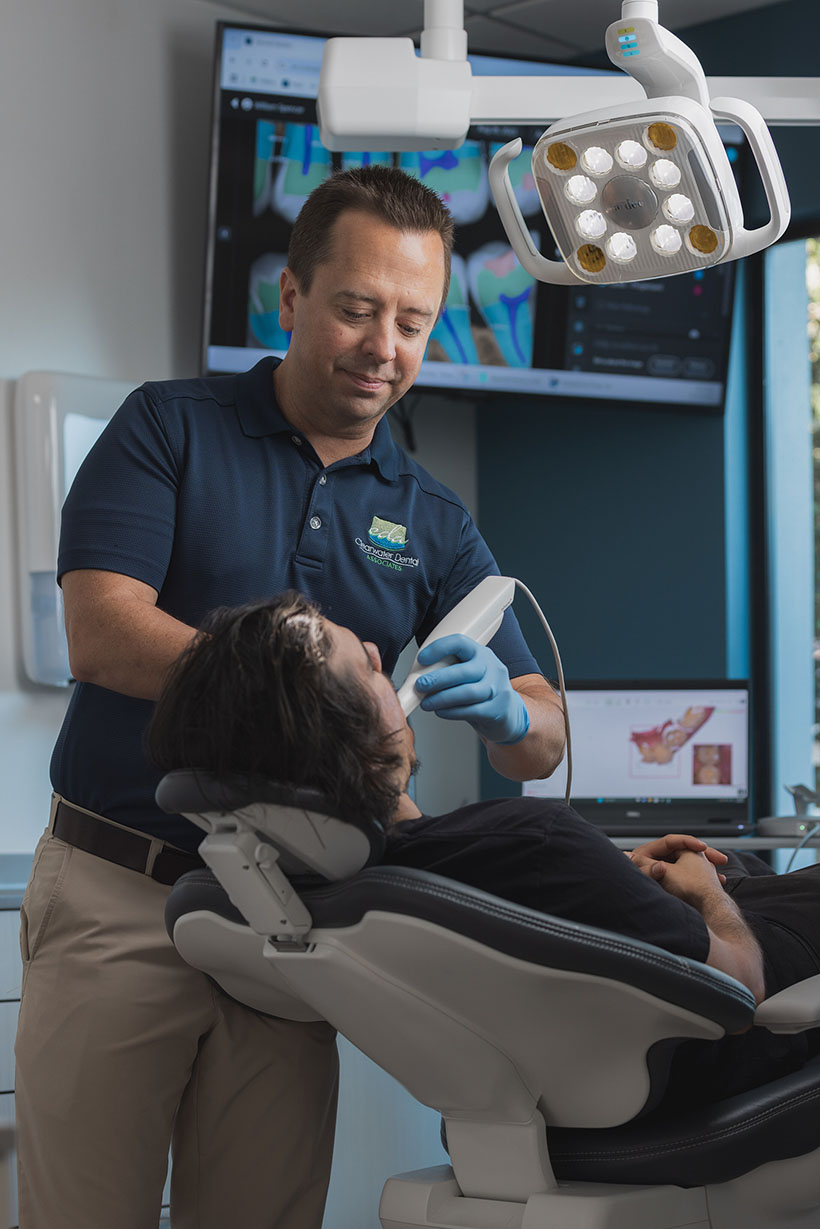 Dr Burton performing in-office professional teeth whitening