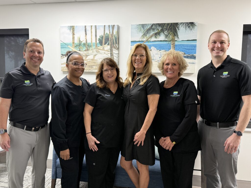 Dunedin Dental Associates team of dentists and dental staff smiling together at their Dunedin, FL dental office
