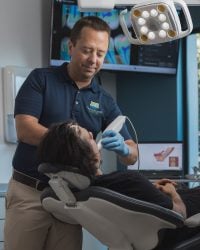 Dr Burton performing in-office professional teeth whitening