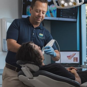 Dr Burton performing in-office professional teeth whitening